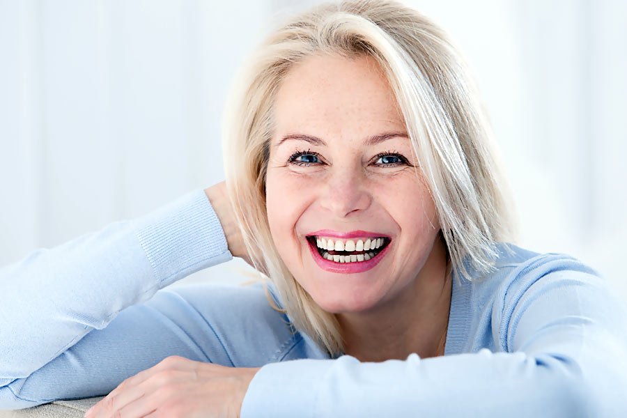 Smiling woman- dental crowns